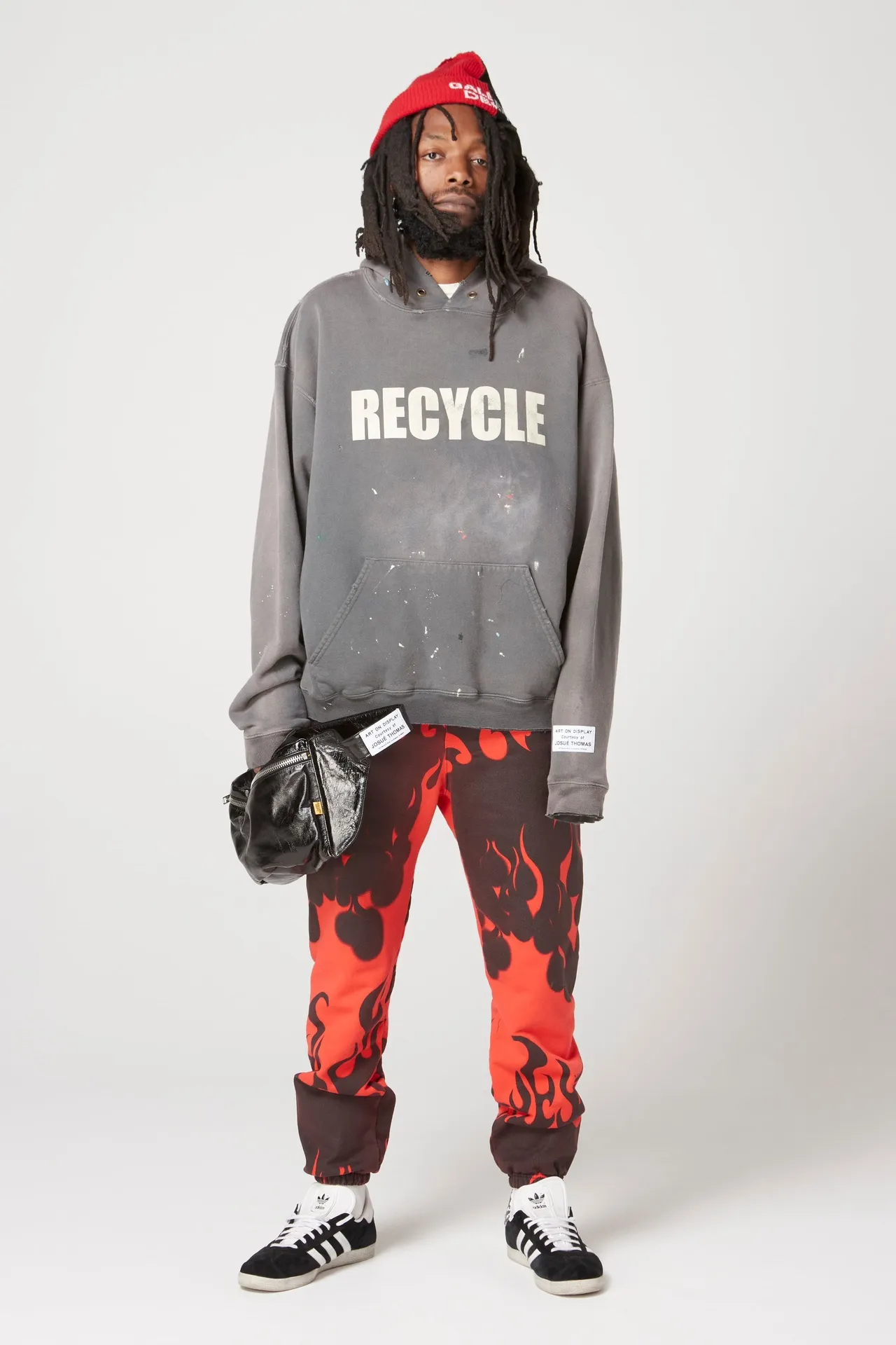 GALLERY DEPT. 90'S RECYCLE HOODIE WASHED BLACK 90'S washed hoodie with distressed eco-friendly slogans. Washed black S-XL. Ready-made garments are washed and dyed again. Multiple spots throughout the body are spray-faded. The ribs are cut and worn.